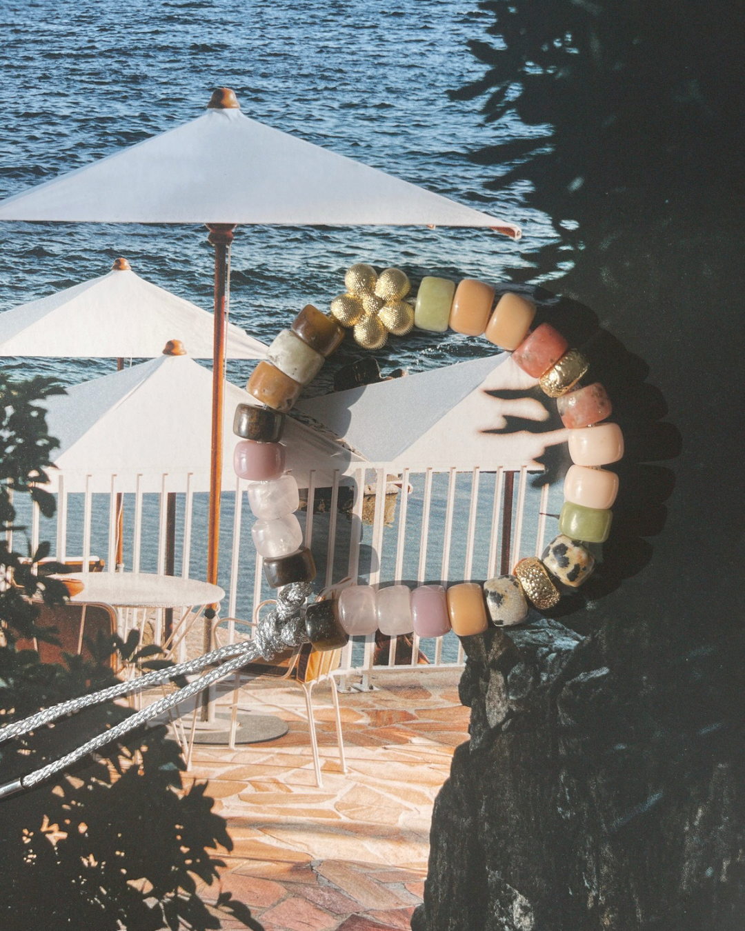 necklace with zebra shells and mother of pearl beads on book pool - Zanzibar necklace - le papillon